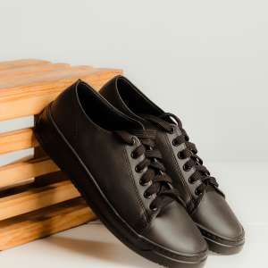 Sleek minimalist low-top black Audi Sport Sneakers