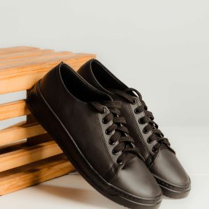 Sleek minimalist low-top black Audi Sport Sneakers