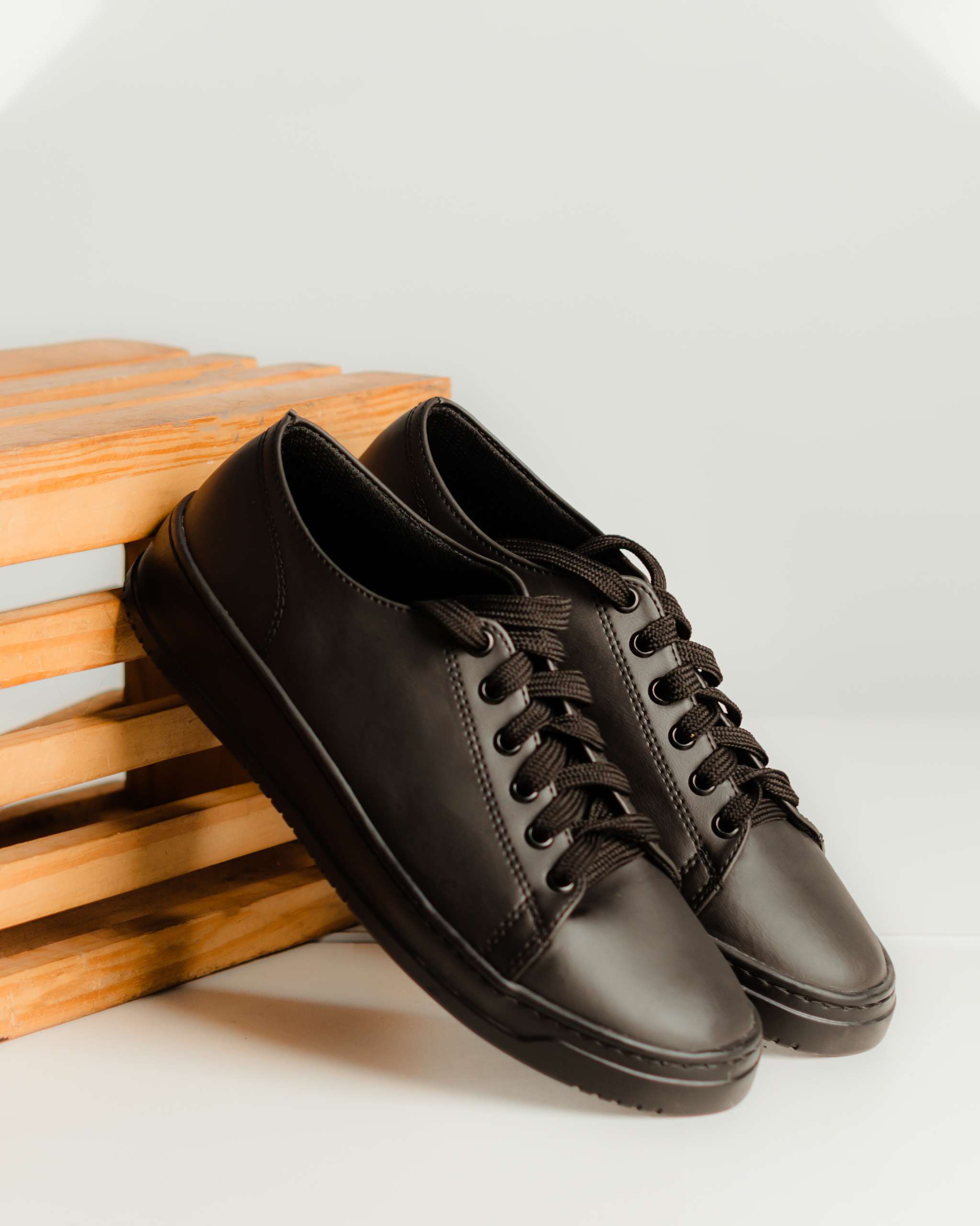 Sleek minimalist low-top black Audi Sport Sneakers